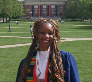 Headshot of Cache Merriweather in graduation regalia